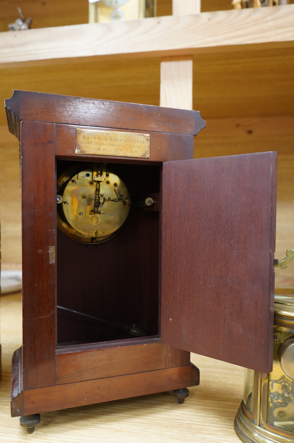 A 19th century oval brass carriage clock, striking on a bell, together with a mahogany and burr yew mantel clock, striking on a coiled gong, gong missing, largest 34cm high